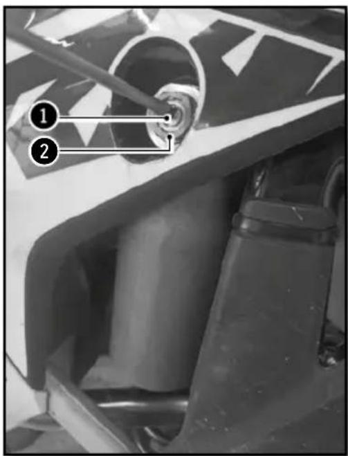 Close-up mechanical component with numbered annotations pointing to features
