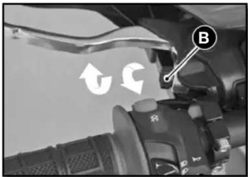 Close-up of a camera lens with directional arrows and a labeled 'B' button, likely indicating navigation or movement.
