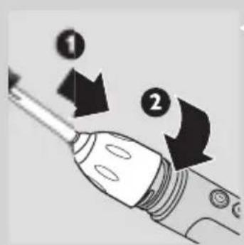 Diagram showing two labeled arrows pointing to a screwdriver tip, with numbered callouts 1 and 2.