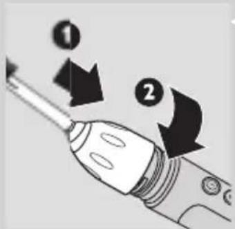 Diagram showing two arrows labeled 1 and 2 pointing to a screwdriver tip, indicating direction of movement or process.