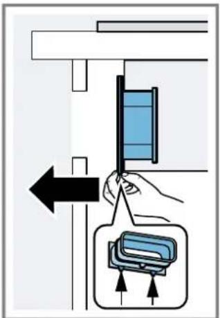 Diagram showing a hand holding a blue panel next to a device with directional arrows, likely illustrating a process or assembly.