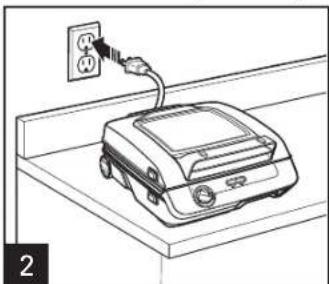 Line drawing of a portable electronic device with power outlet and cable (no text or symbols)