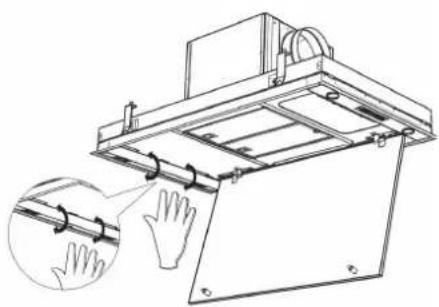 Technical line drawing of a mechanical device with a magnified inset showing hand positioning (no text or symbols)