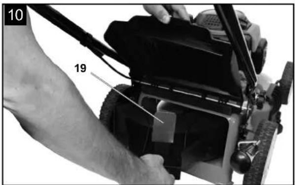 Close-up of a person using a lawn mower on a machine, with no visible text or symbols