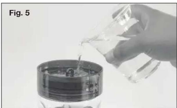 Sun Joe SJWBFGRED - Filling the Ant Moat - 1