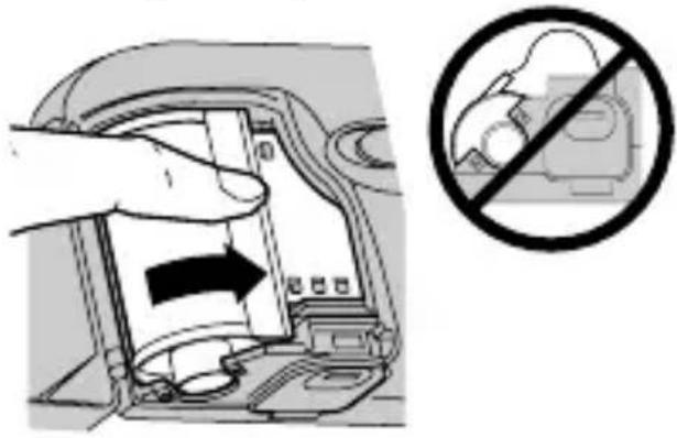 Diagram showing a hand inserting a device into a device with an arrow indicating direction, alongside a prohibition symbol.