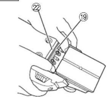 Technical diagram showing hands holding a device with numbered parts labeled 19 and 22