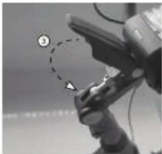 Close-up of a robotic hand holding a device with a numbered callout and a dashed circular diagram highlighting a point labeled '3'.