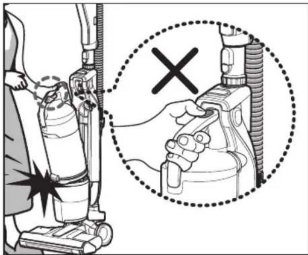 Diagram showing a person using a vacuum cleaner with a magnified view indicating the correct inspection of the device.