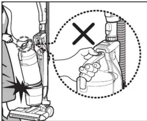 Diagram showing a person using a vacuum cleaner with a magnified view indicating the correct inspection of the device.