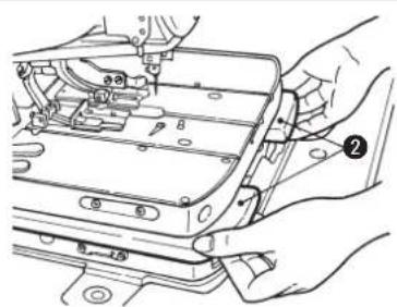 Technical diagram showing hands installing or adjusting a mechanical component with numbered callouts