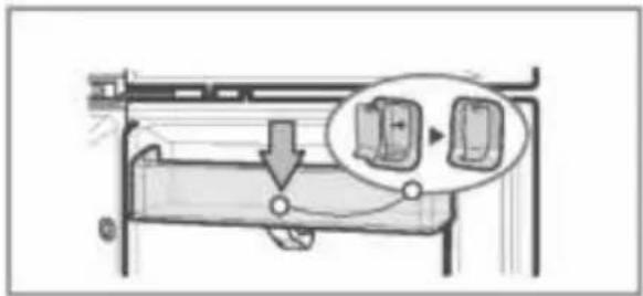 Diagram showing a mechanical component with a magnified inset highlighting two labeled components, likely illustrating a process or assembly.