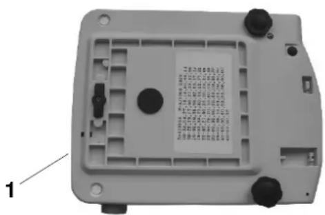 Technical diagram of a device casing with labeled components and a printed label on the cover.
