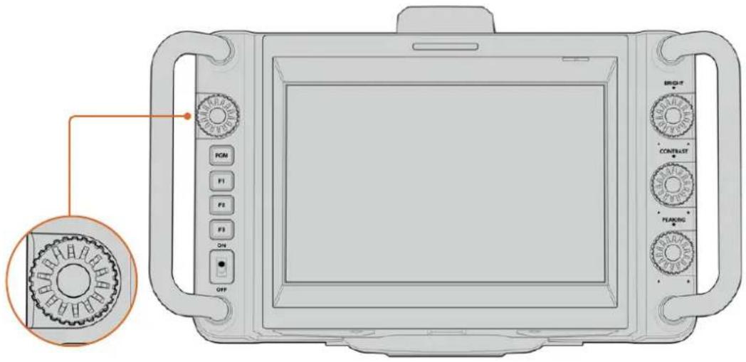 Diagram of a medical imaging device with labeled control knobs and a gear mechanism diagram pointing to the left side.