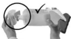 Close-up of hands holding a device with a magnified circular detail (no visible text or symbols)