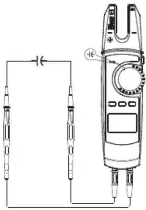 Diagram of a multimeter connected to two probes with a battery, showing wiring and polarity labels