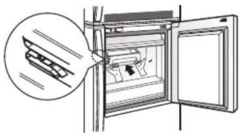 Diagram showing a refrigerator with a hand inserting a tray into the door, indicating a device's internal structure.