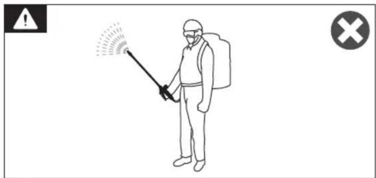 Safety warning illustration showing a person spraying disinfectant with warning symbol and cross symbol