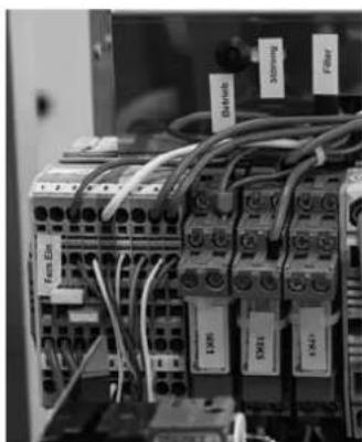 Electrical control panel with labeled components (no readable text or symbols beyond labels)
