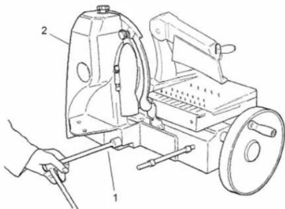 Technical diagram of a mechanical device with labeled parts, showing hand operating tool and workpiece assembly