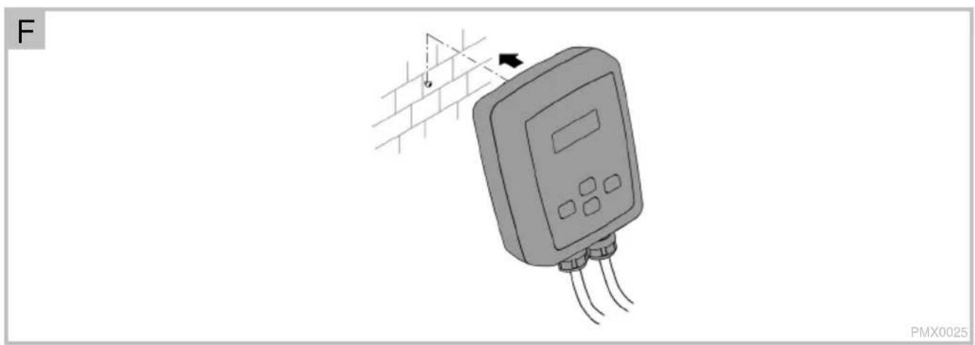 Illustration of a digital pressure meter connected to a brick wall, with no visible text or symbols on the device itself.