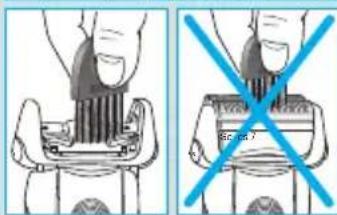Diagram showing two methods of removing a device into a seatbelt, with a blue X symbol indicating prohibition.