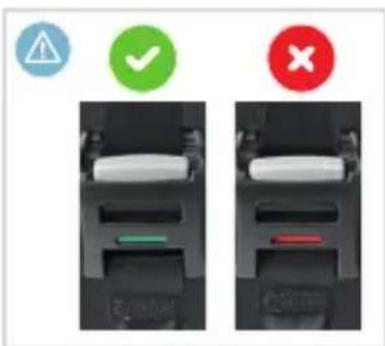 Diagram showing two identical device compartments with warning icons: triangular warning symbol, green checkmark, and red cross.