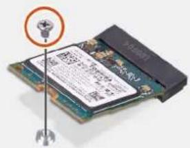 Close-up of a microprocessor board with a highlighted component and printed text, showing a logo and warning symbol.