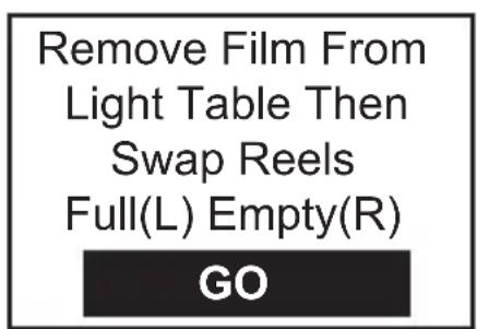 Remove Film From Light Table Then Swap Reels Full(L) Empty(R) GO
