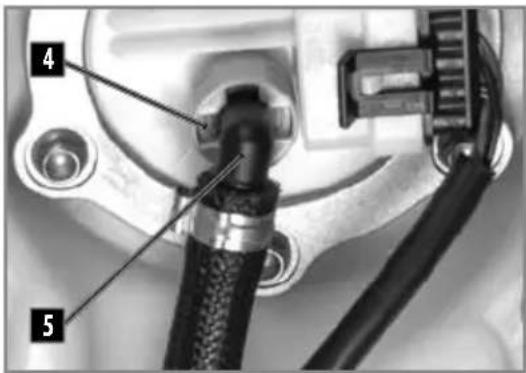 Close-up of mechanical components with numbered labels pointing to features