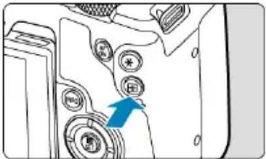 Diagram showing a device with labeled buttons and an arrow pointing to a component, likely indicating a directional or process flow.