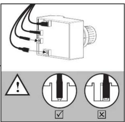 Diagram showing a device with warning symbols and two cross-sectional views of a mechanical component.