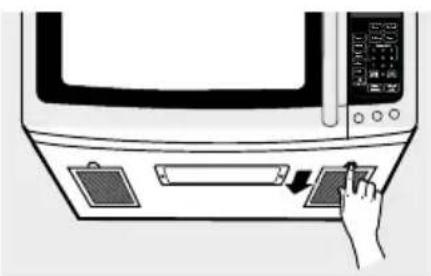 Diagram showing a hand pressing down on a microwave oven control panel with a digital display and arrow indicating action.