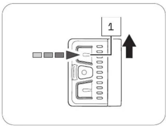 Diagram showing a device with labeled components and an arrow indicating direction, possibly illustrating a process or assembly.