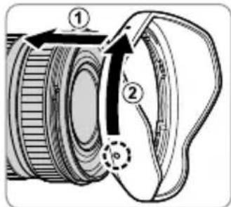 Diagram of a camera lens with numbered parts and directional arrows indicating motion or assembly.