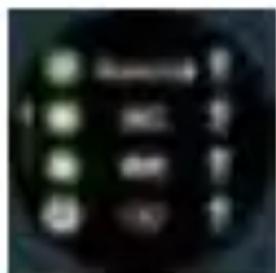 Close-up of a black circular device with illuminated control buttons and text labels