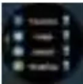 Blurred image with indistinct white text on dark background, possibly a logo or label