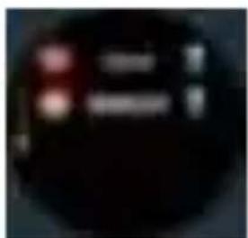 Blurred image with red and white symbols on dark background, possibly a UI element or button