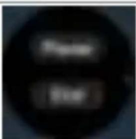 Blurred image with two indistinct dark circular shapes, possibly text or symbols