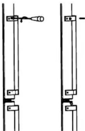Pure mechanical diagram showing two vertical supports with a handle and a small circular component, no text or symbols present.