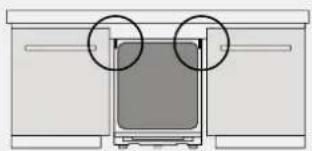 Diagram of a device with two circular annotations pointing to a central screen (no text or symbols present)