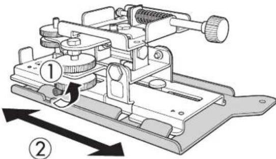 Technical diagram of a mechanical device with numbered parts and directional arrows indicating motion or assembly.