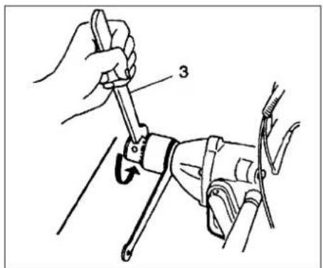 Technical diagram showing a hand using a wrench to adjust a mechanical component, labeled with number 3.