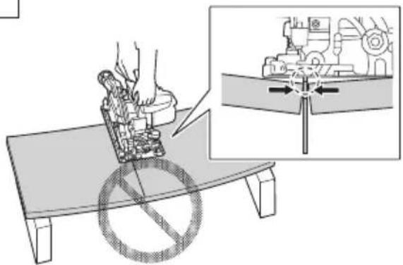 Technical diagram showing a robotic arm operating on a bench with an inset close-up of the mechanical component being inserted.