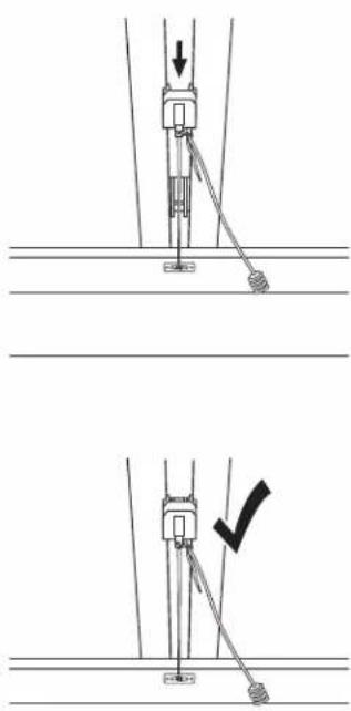 Technical diagram showing two mechanical assembly steps with a downward arrow and checkmark indicating a detail or adjustment.