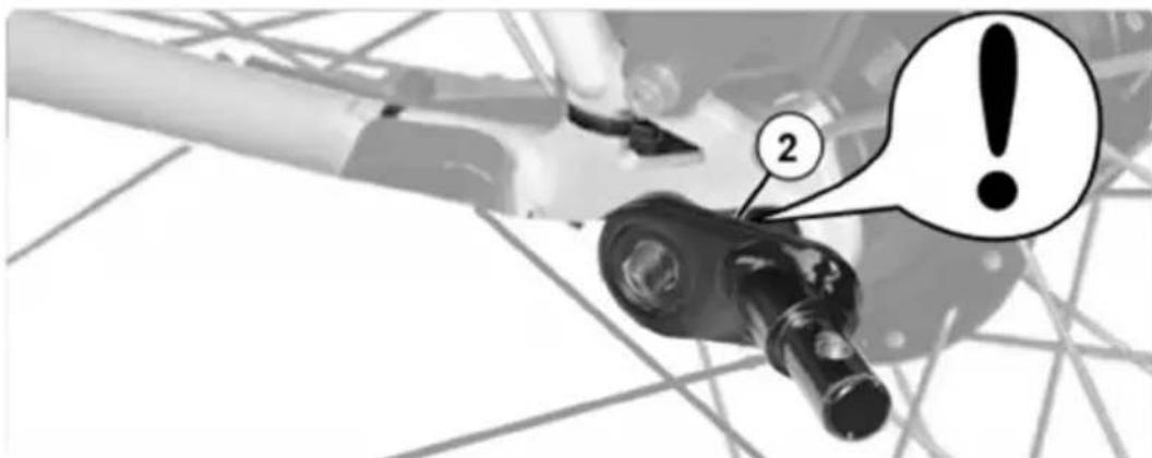 Diagram showing a mechanical component with labeled parts and an exclamation mark, likely indicating warning or error.