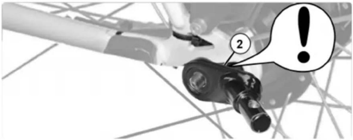 Diagram showing a mechanical component with labeled parts and an exclamation mark, likely indicating a warning or alert.