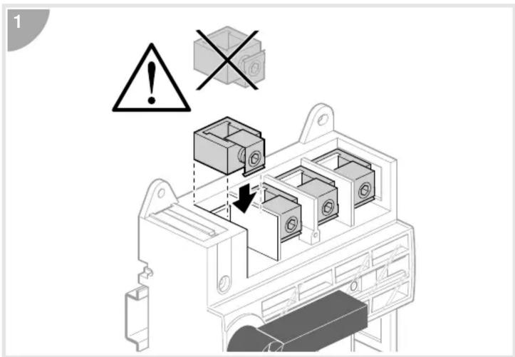 Technical diagram showing a mechanical assembly with warning symbols and labeled components, including a warning triangle and cross symbol.