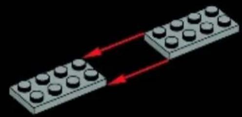 Two LEGO blocks with circular tops, each connected by red arrows indicating direction (no text or symbols).