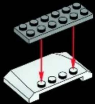 Diagram of a LEGO base with four circular components and red arrows indicating movement or force, no text or symbols.